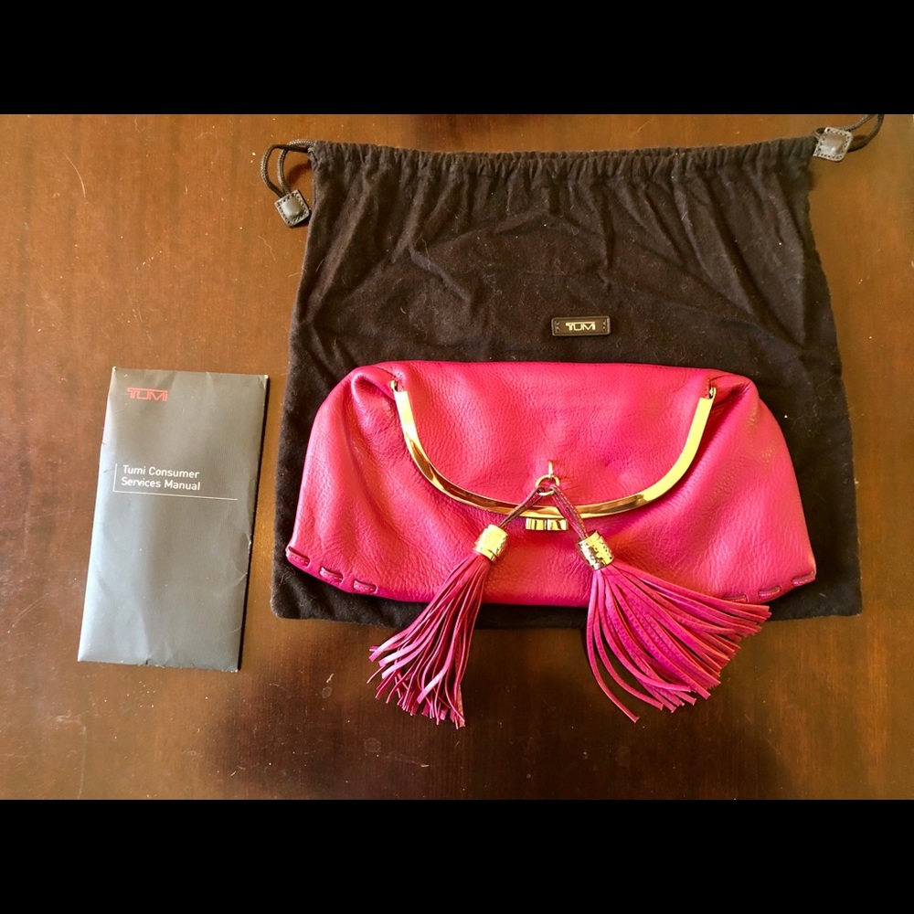 TUMI leather clutch w/ tassels
